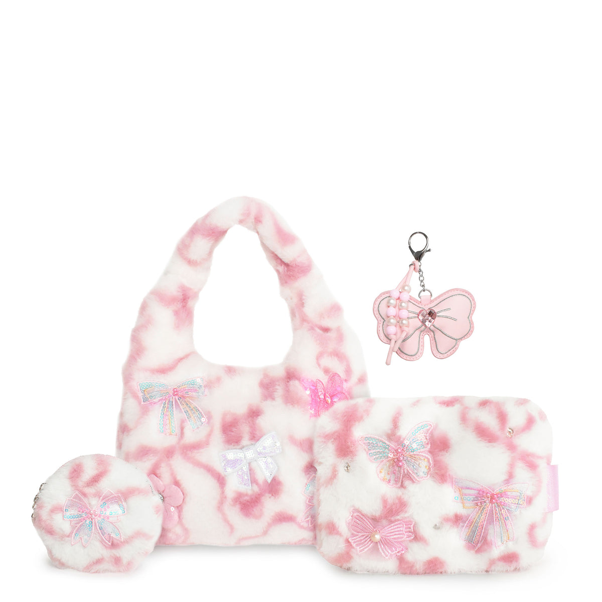 A pink and white plush gift set eaturing a fuzzy hobo bag, matching pouch, and keychain accessories decorated with bows and butterfly motifs.