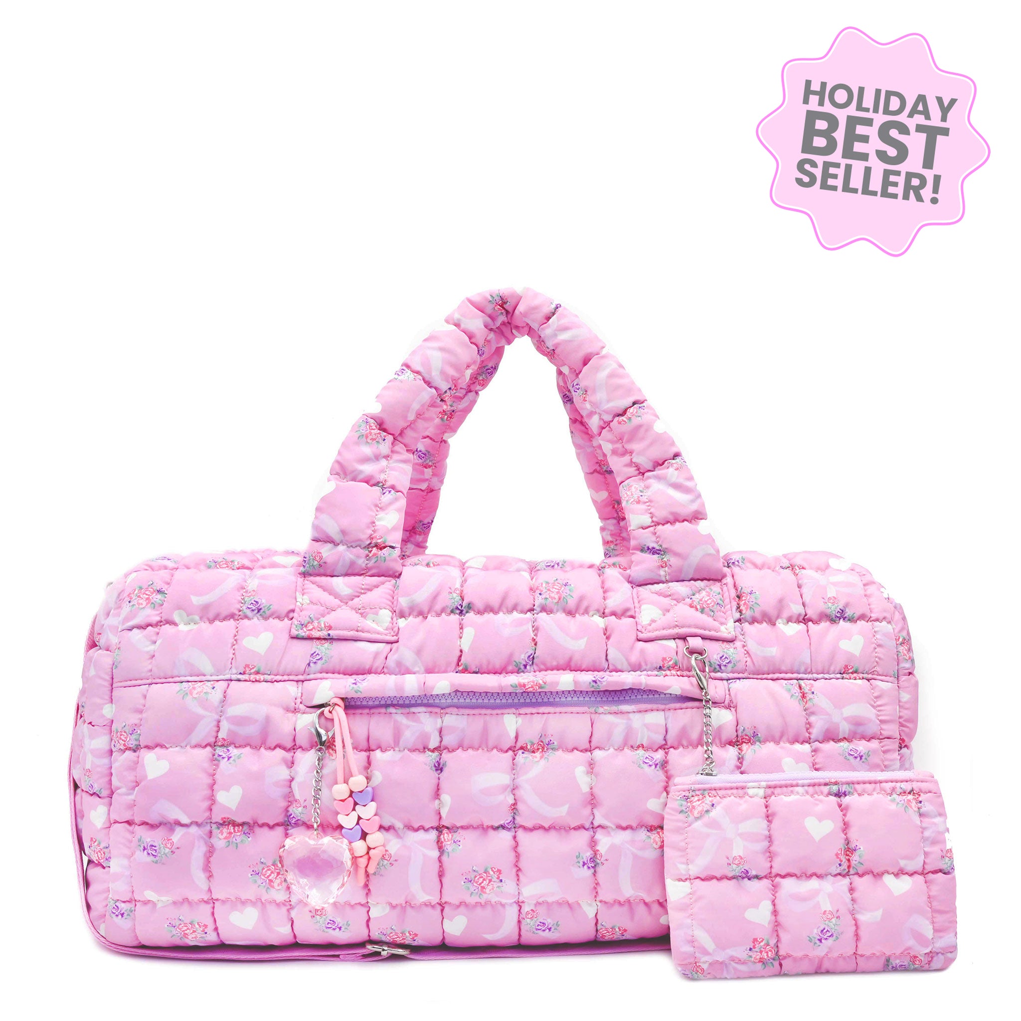 front facing view of a pink large sized quilted scrunch nylon duffle bag with a bow and heart print and front beaded zipper pocket with a crystal heart charm and matching detachable coin pouch