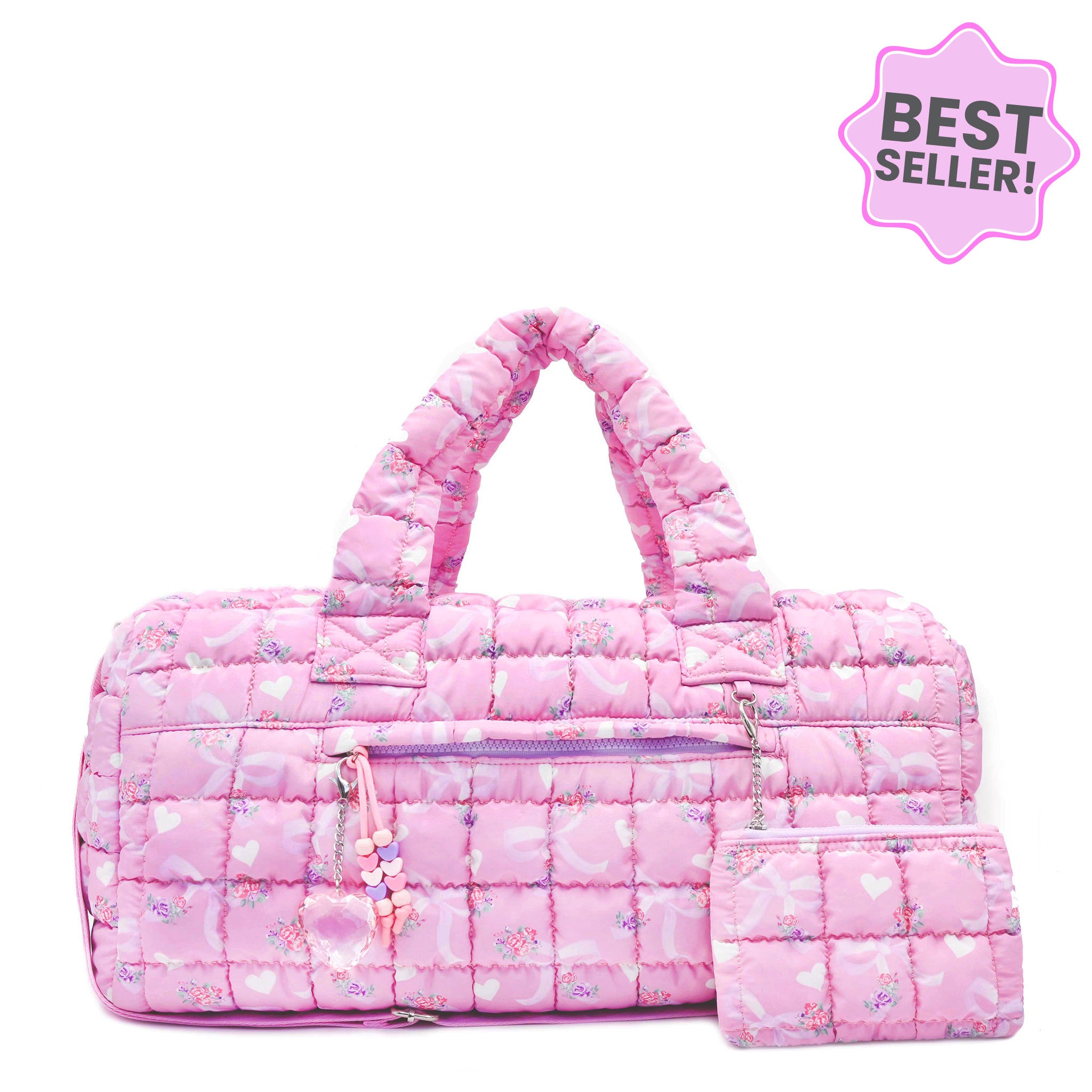 front facing view of a pink large sized quilted scrunch nylon duffle bag with a bow and heart print and front beaded zipper pocket with a crystal heart charm and matching detachable coin pouch