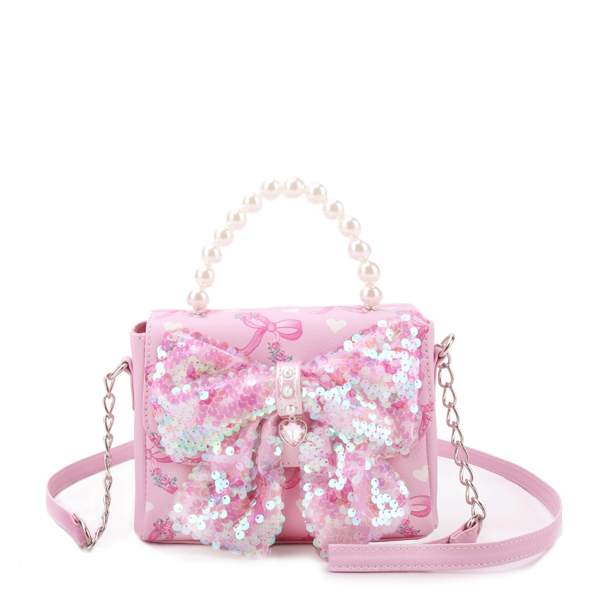 front view of a bow printed mini bag with beaded pearl handle & sequin bow applique on front flap