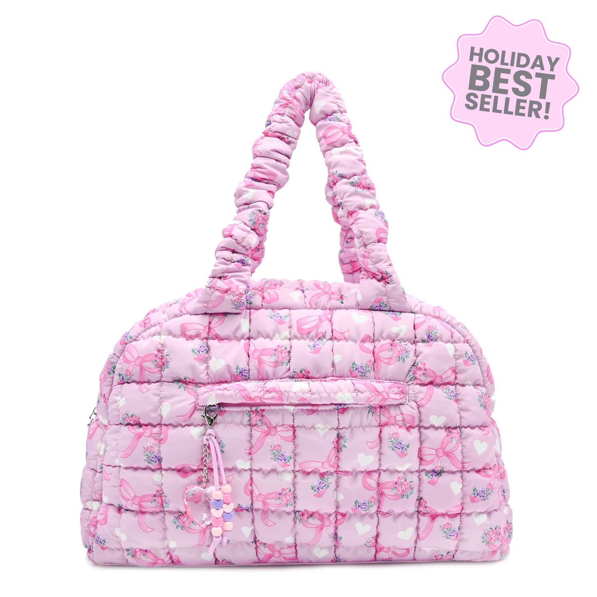 Pink quilted handbag with floral bow pattern on a white background, labeled as a holiday best seller.
