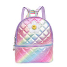 Front view of a rainbow ombre metallic quilted mini backpack with a glitter daisy appliqué 