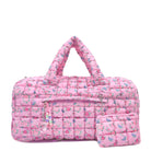 front facing view of a pink large sized quilted scrunch nylon duffle bag with a floral print and front beaded zipper pocket with a crystal heart charm and matching detachable coin pouch