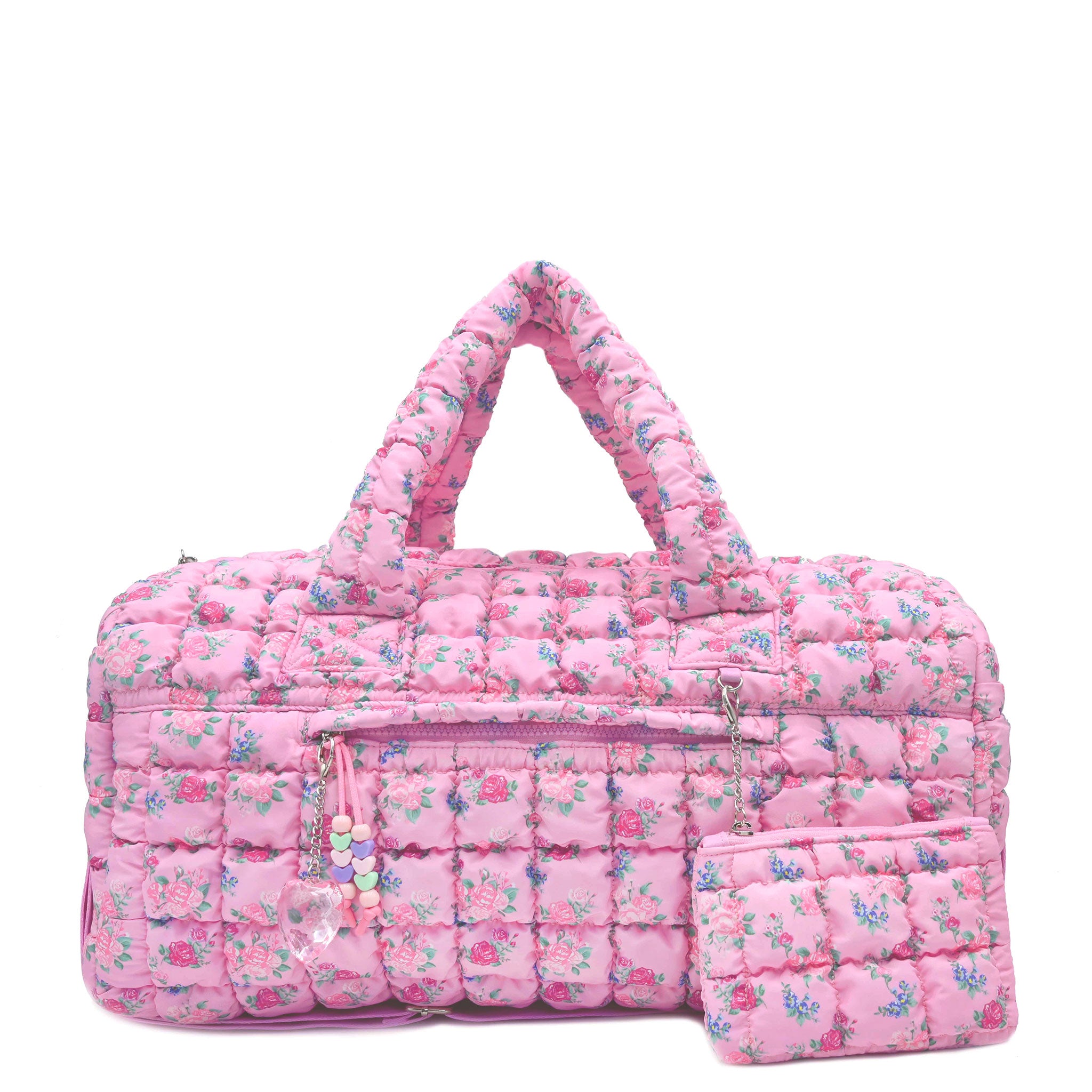 front facing view of a pink large sized quilted scrunch nylon duffle bag with a floral print and front beaded zipper pocket with a crystal heart charm and matching detachable coin pouch