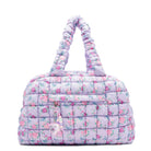 front facing view of a purple medium sized quilted scrunch nylon duffle bag with a floral print and front beaded zipper pocket with a crystal heart charm