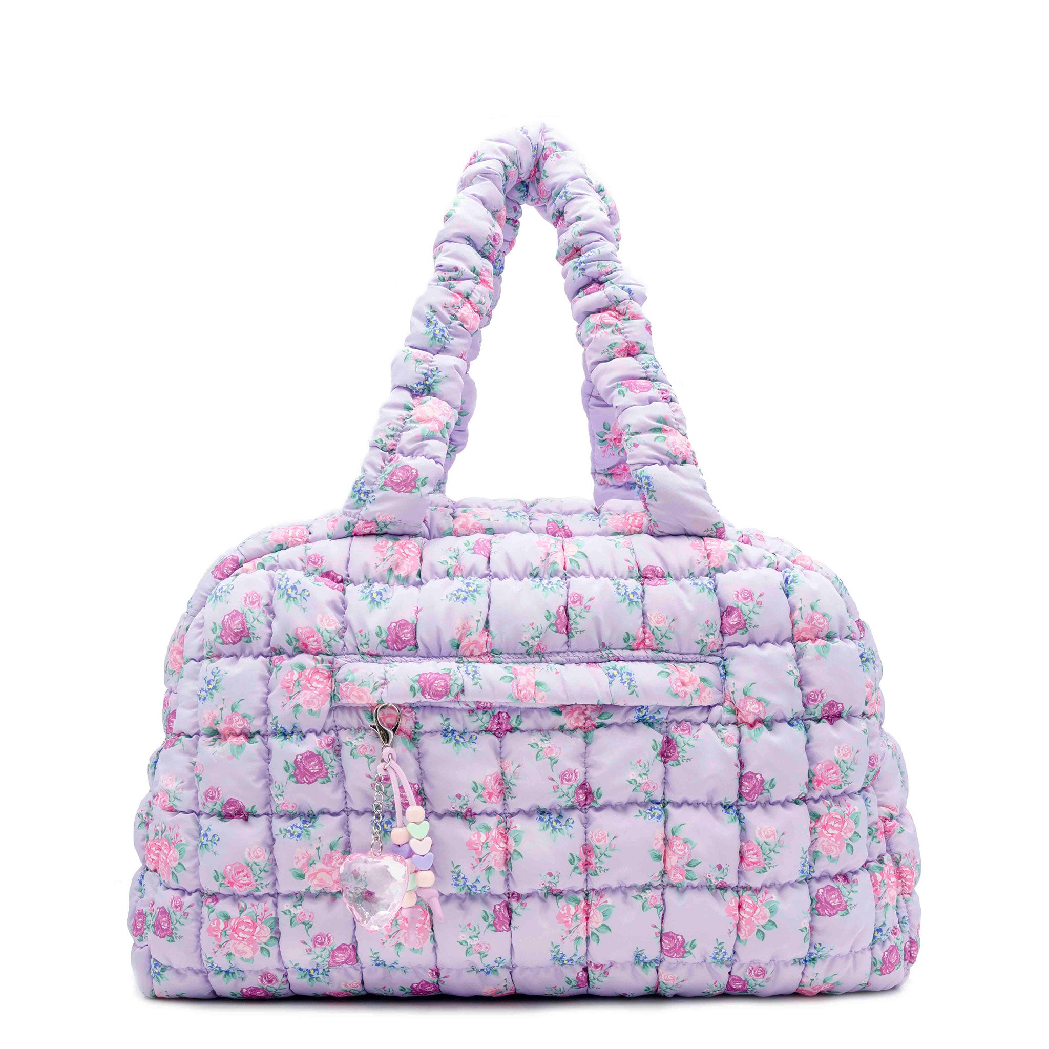 front facing view of a purple medium sized quilted scrunch nylon duffle bag with a floral print and front beaded zipper pocket with a crystal heart charm