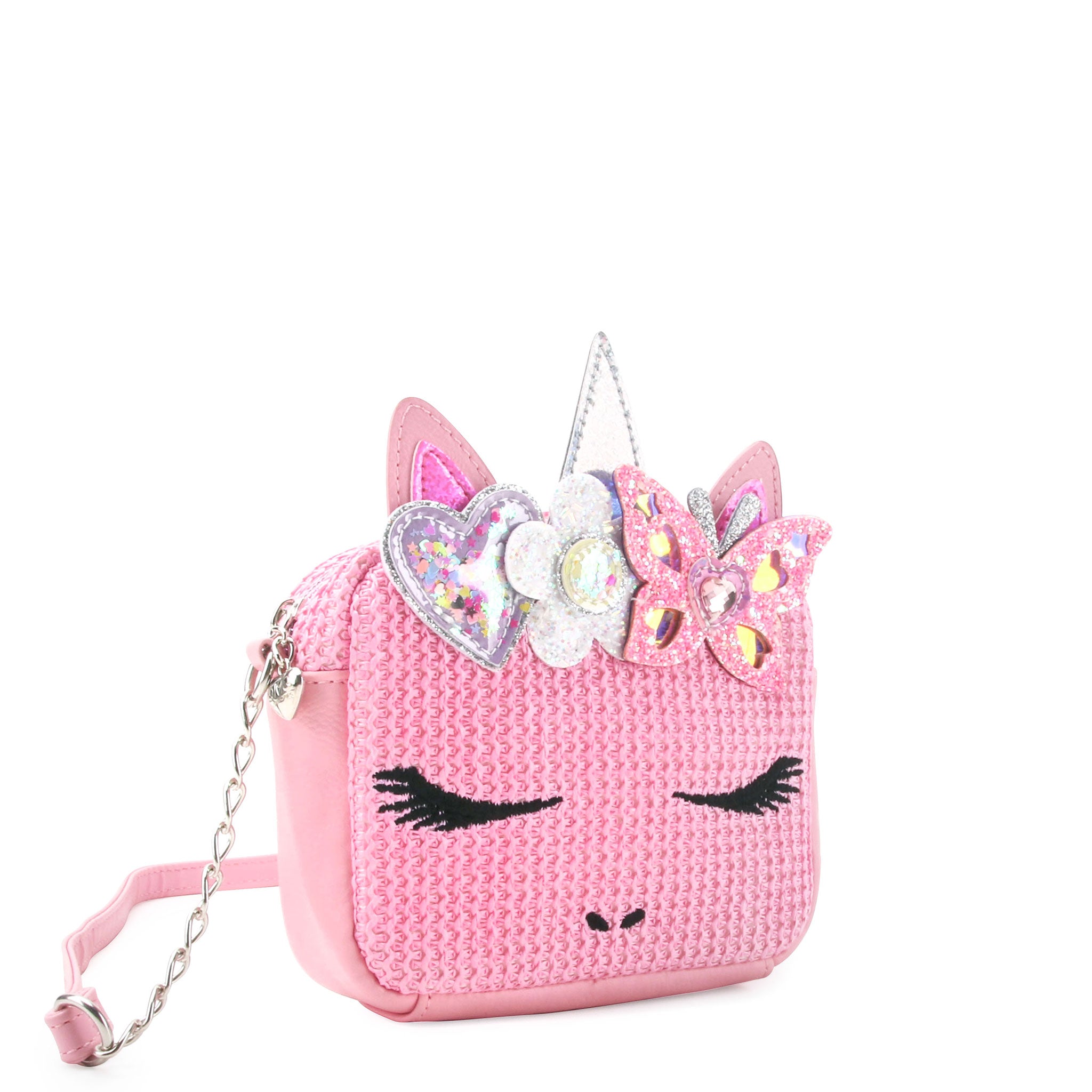 side view of a pink straw unicorn crossbody bag with a glitter butterfly & flower crown