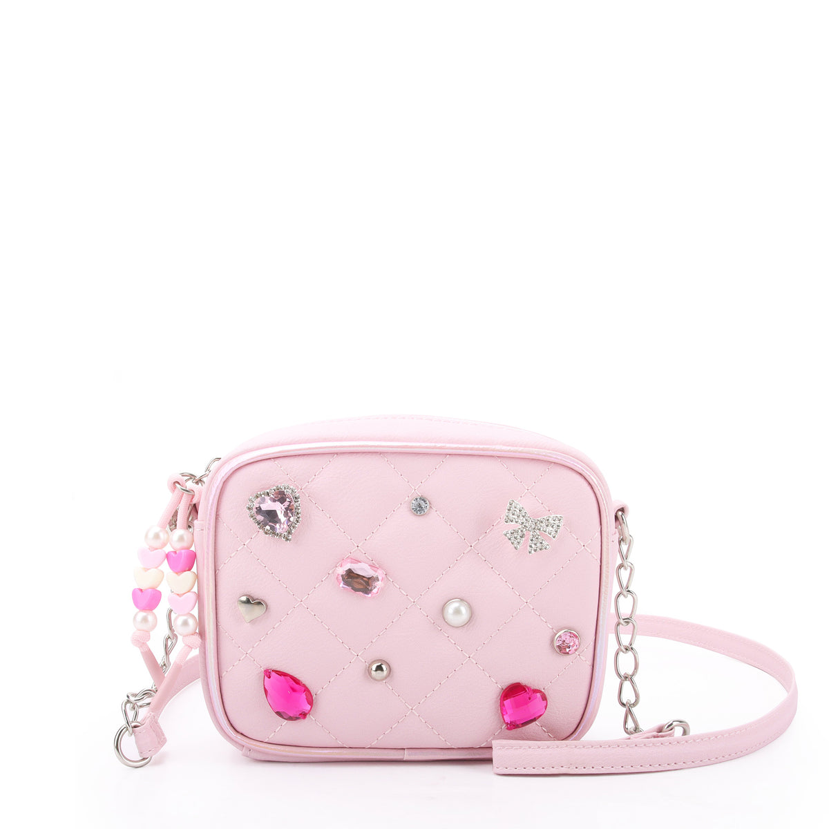 front view of a light pink quilted crossbody bag with pear, rhinestone & gem appliques along with a heart beaded zipper pull