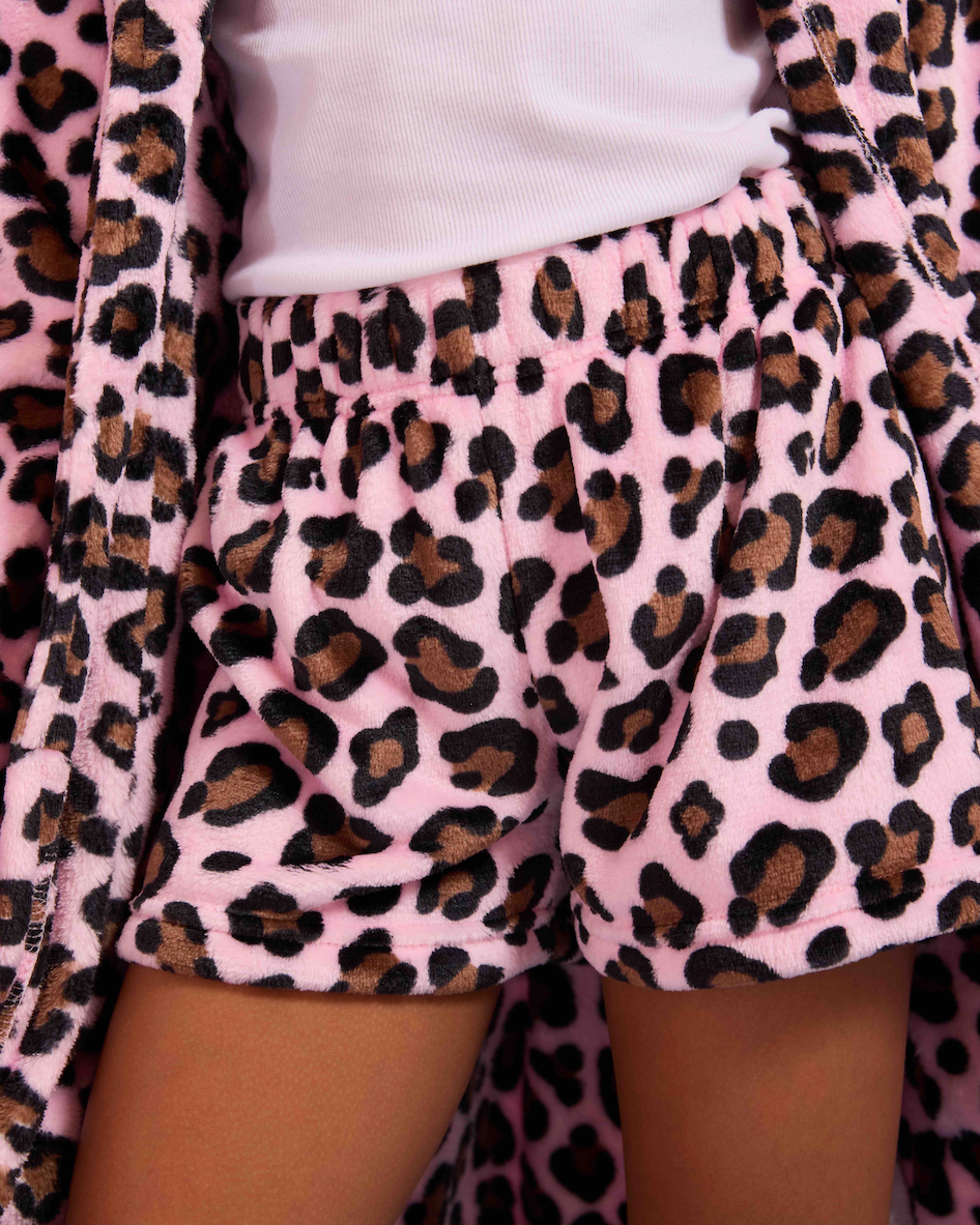 Person wearing pink shorts with leopard print pattern