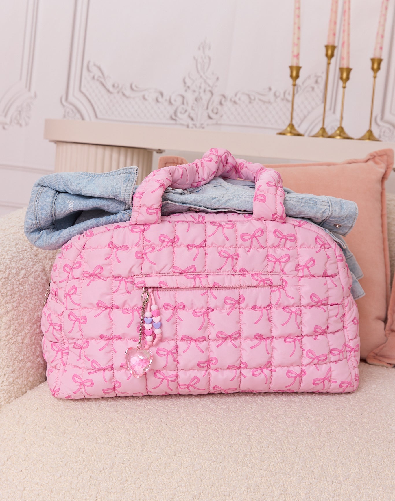 front view of pink medium bow printed scrunch duffle