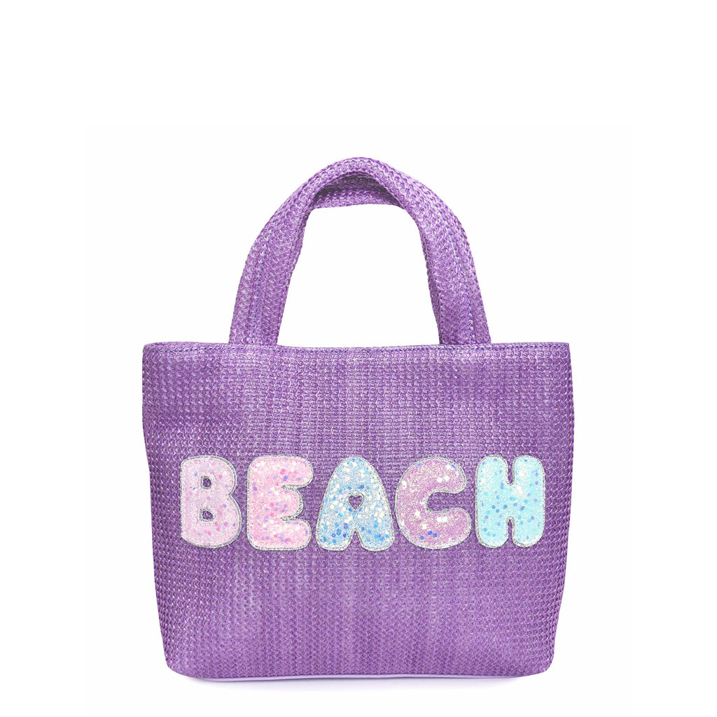 Front view of purple straw mini tote bag embellished with glitter bubble letter 'BEACH' appliqué 