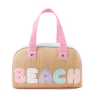 front view of a straw colorblocked medium beach bag with glitter letters 'beach'