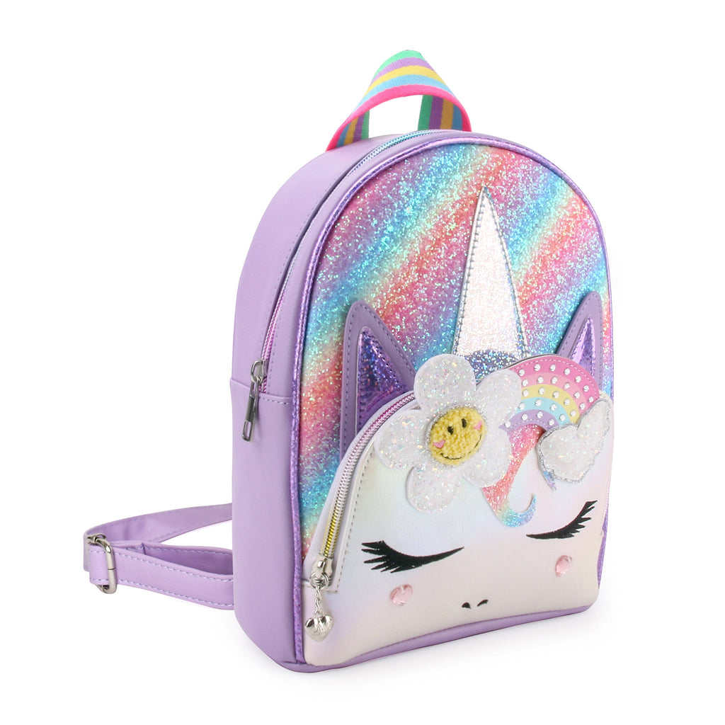 Side view of purple glitter, unicorn face mini backpack with glitter rainbow and smiley face flower appliqués 