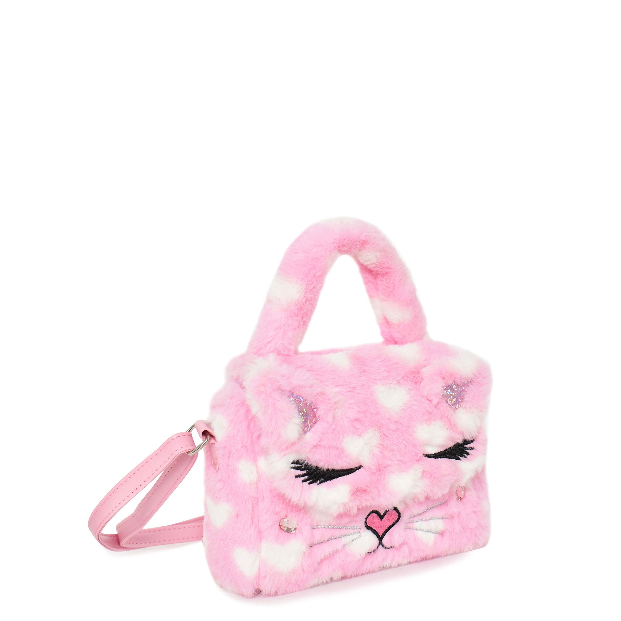 side  view of a plush heart-printed flap front top handle mini bag with a kitty cat face appliqué.