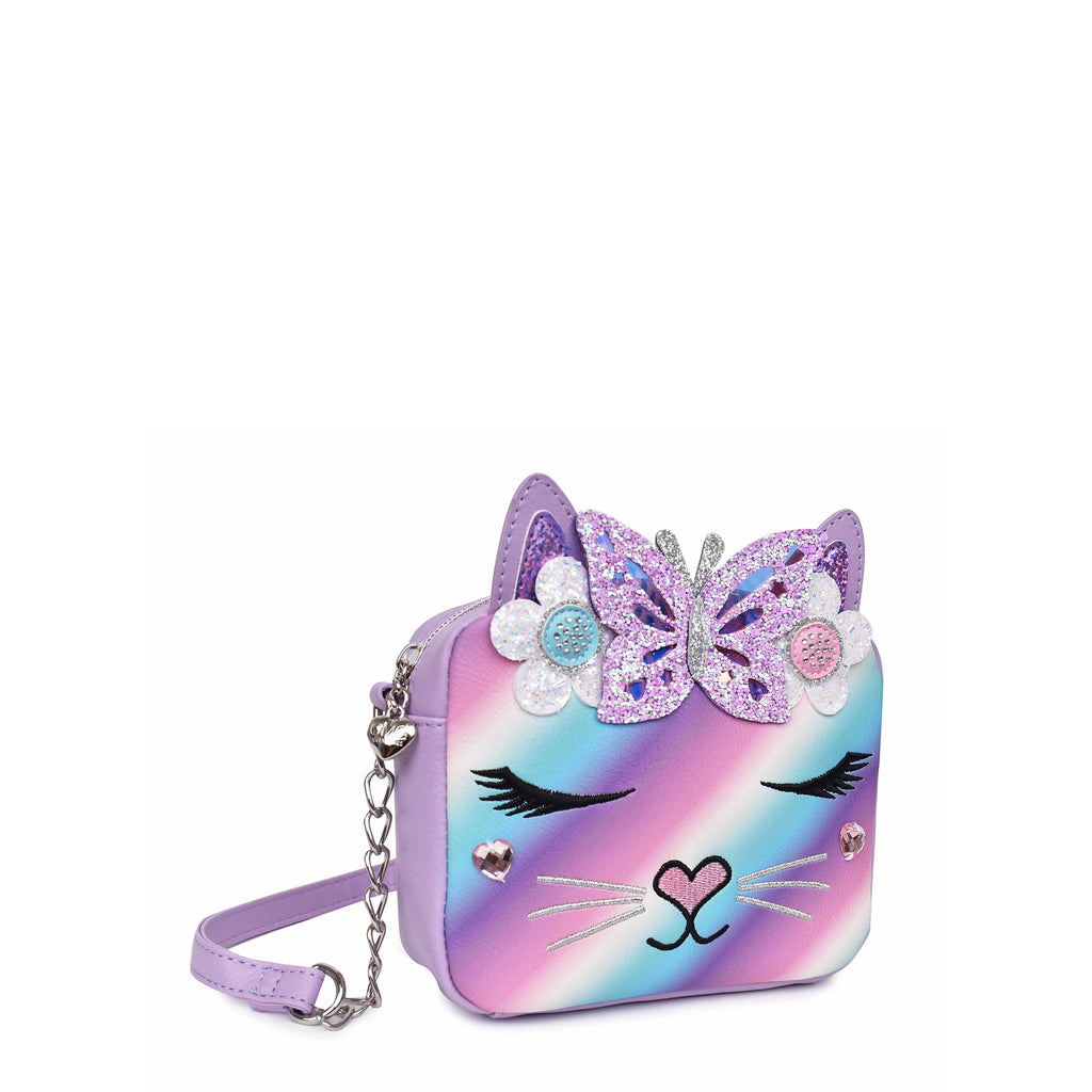 Side view of a cool pastel ombre kitty cat face crossbody embellished with glitter flowers and butterfly appliqués