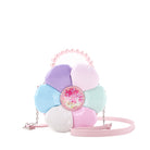 front view of a multi colored vinyl daisy shaped crossbody bag with a pink pearl beaded top handle.