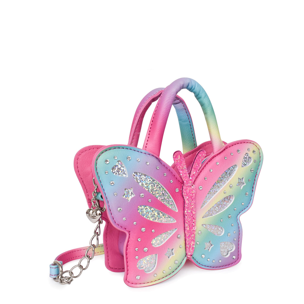 Side view of ombre striped butterfly shaped top handle crossbody