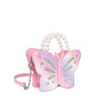 Side view of a glitter butterfly shaped crossbody bag with a pearl beaded top-handle
