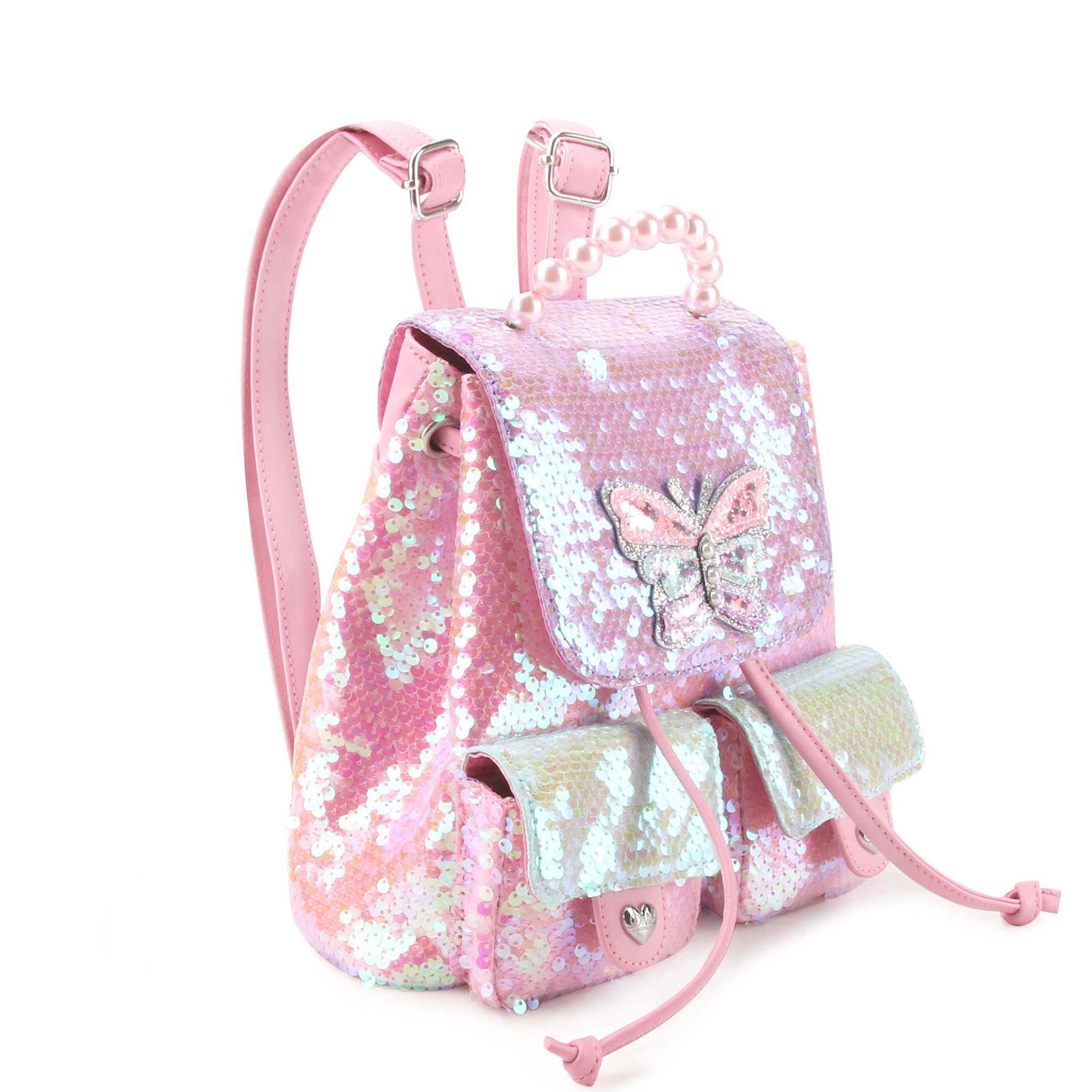 side  view of a sequin color blocked drawstring flip front mini backpack with a pearl top handle & confetti filled butterfly patch.