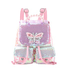 front view of a sequin color blocked drawstring flip front mini backpack with a pearl top handle & confetti filled butterfly patch.