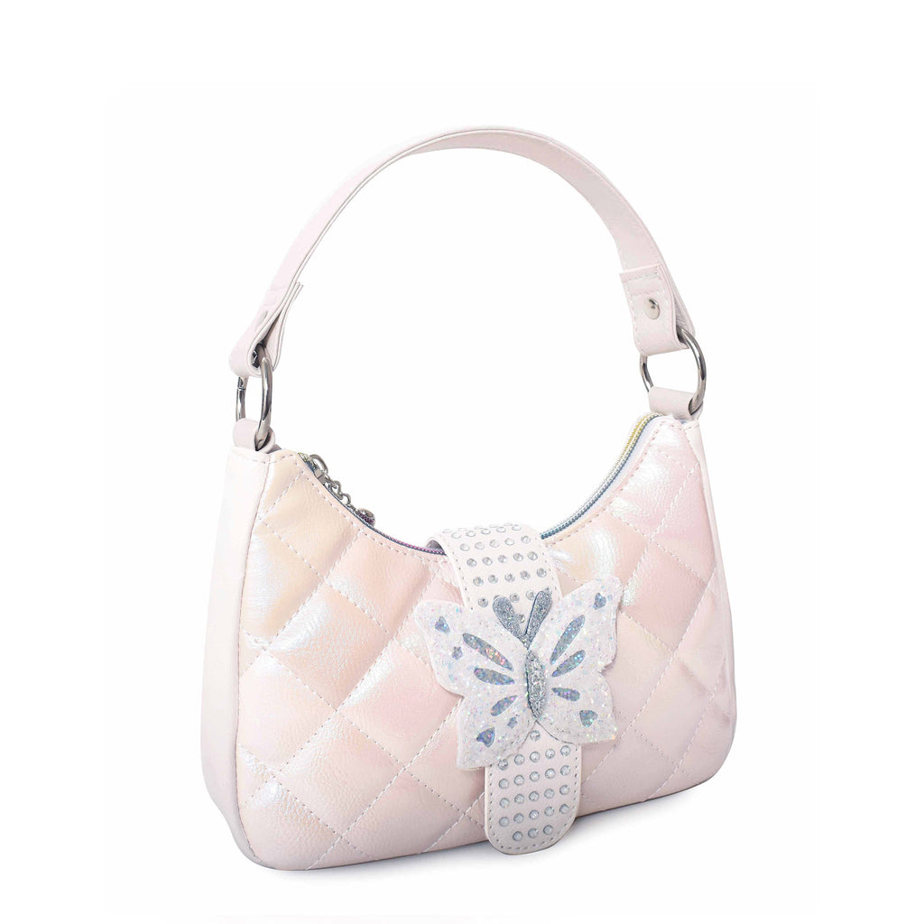 Side view of white metallic quilted hobo bag with rhinestone and glitter butterfly buckle