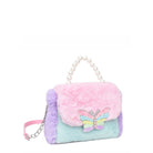 side view of a color block plush mini bag with a pearl beaded top handle with a glitter butterfly applique.