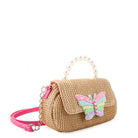 side  view of a straw baguette shaped crossbody bag with a flap front closure & pearl beaded top handle. topped with a glitter butterfly appliqué