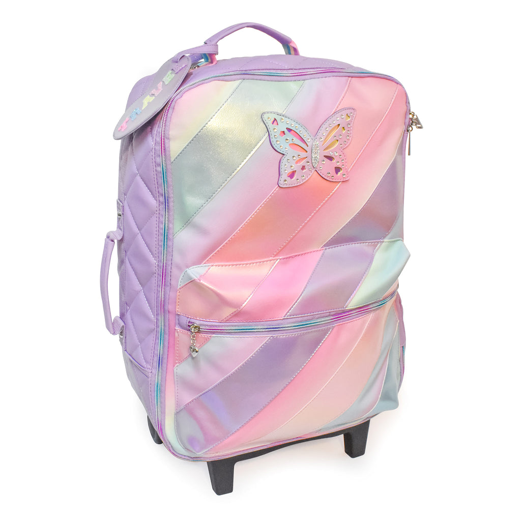 Side view of metallic striped rolling luggage with rhinestone butterfly patch and 'Travel' luggage tag