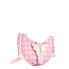 side view of a pink woven crescent shaped crossbody bag with a rhinestone closure strap & a glitter butterfly appliqué 
