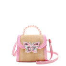 Front view of a straw top handle crossbody bag with a pink pearl beaded handle and a confetti filled butterfly patch.