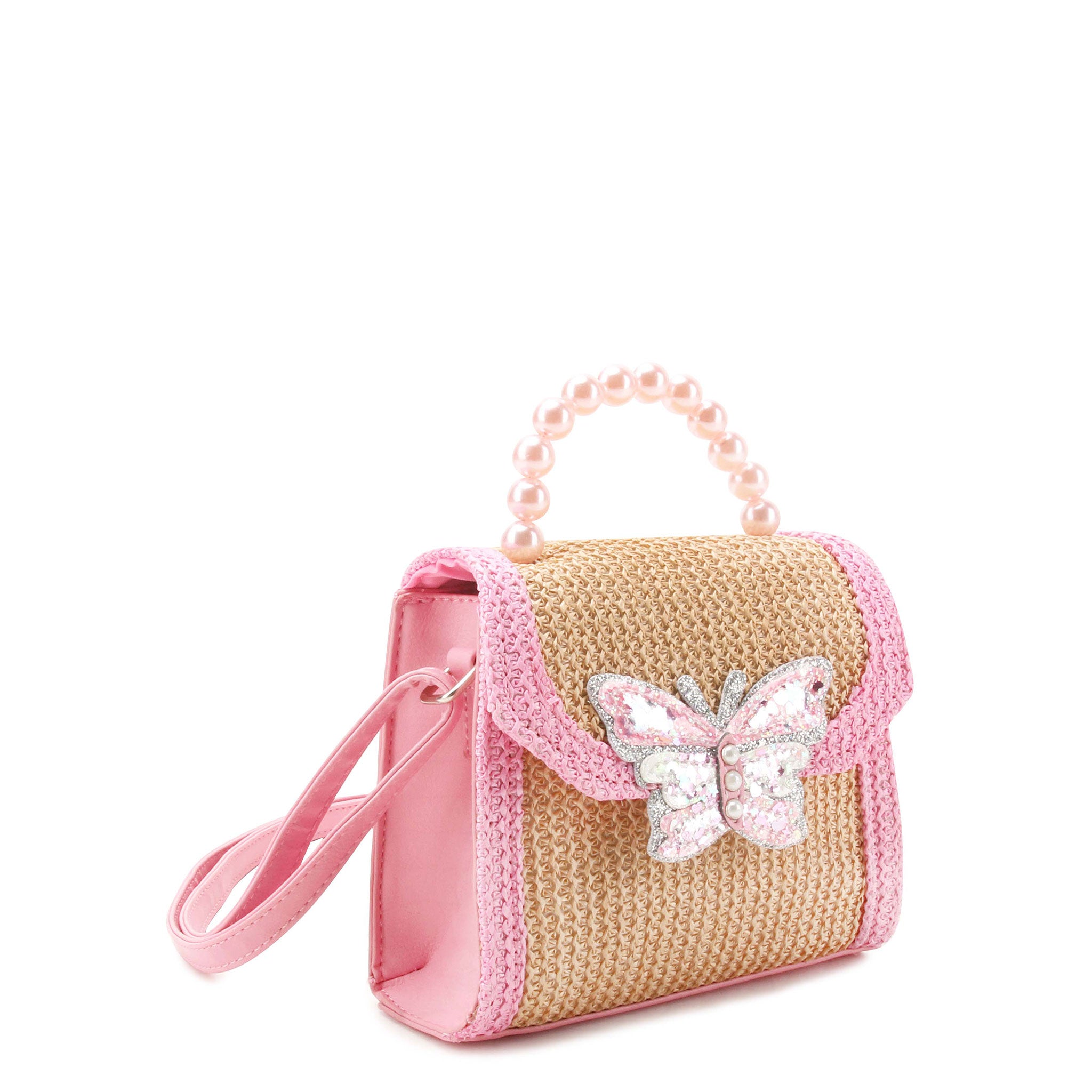 side view of a straw top handle crossbody bag with a pink pearl beaded handle and a confetti filled butterfly patch.