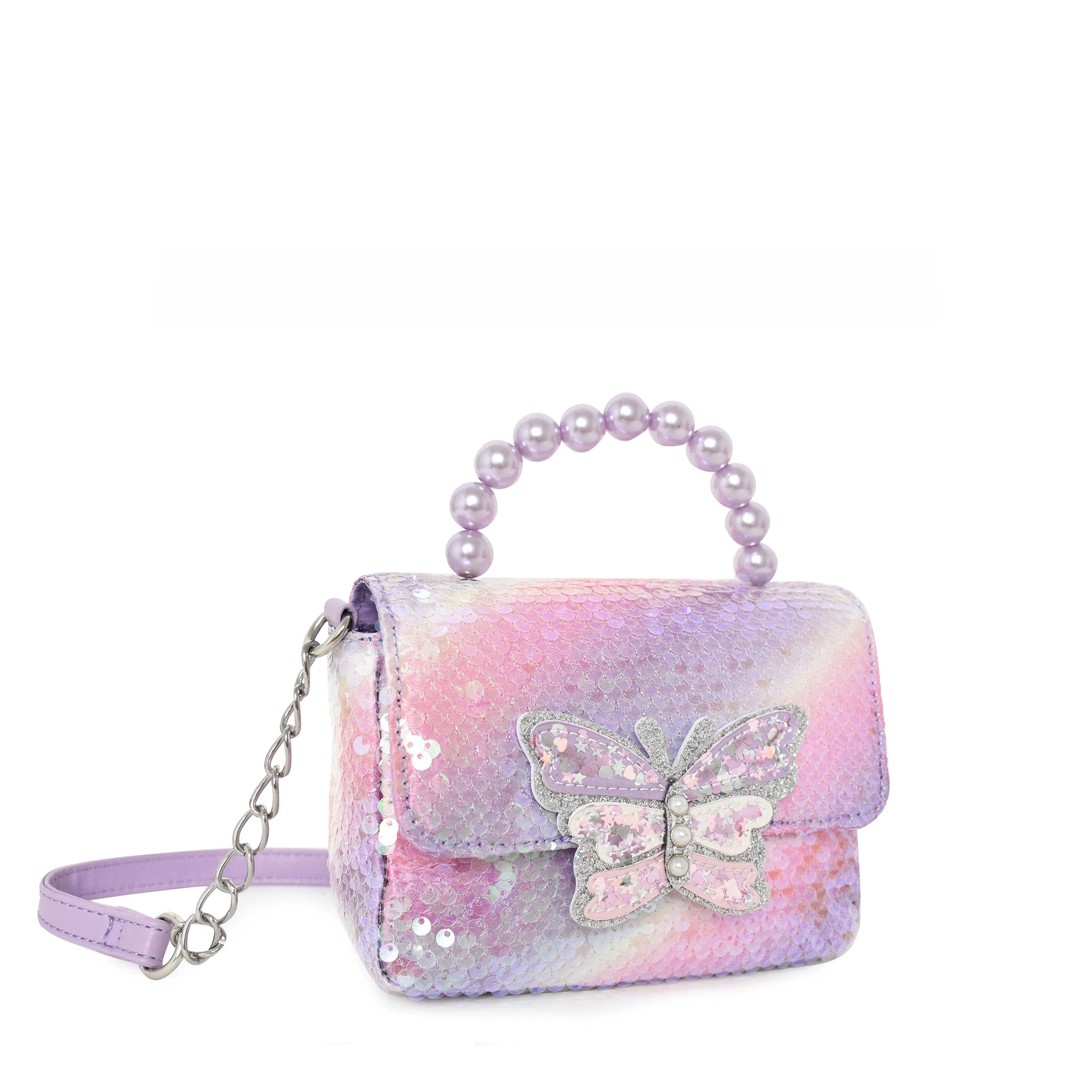 side view of an ombre sequin flap front crossbody with a confetti filled butterfly closure appliqué. Purple pearl beaded top handle