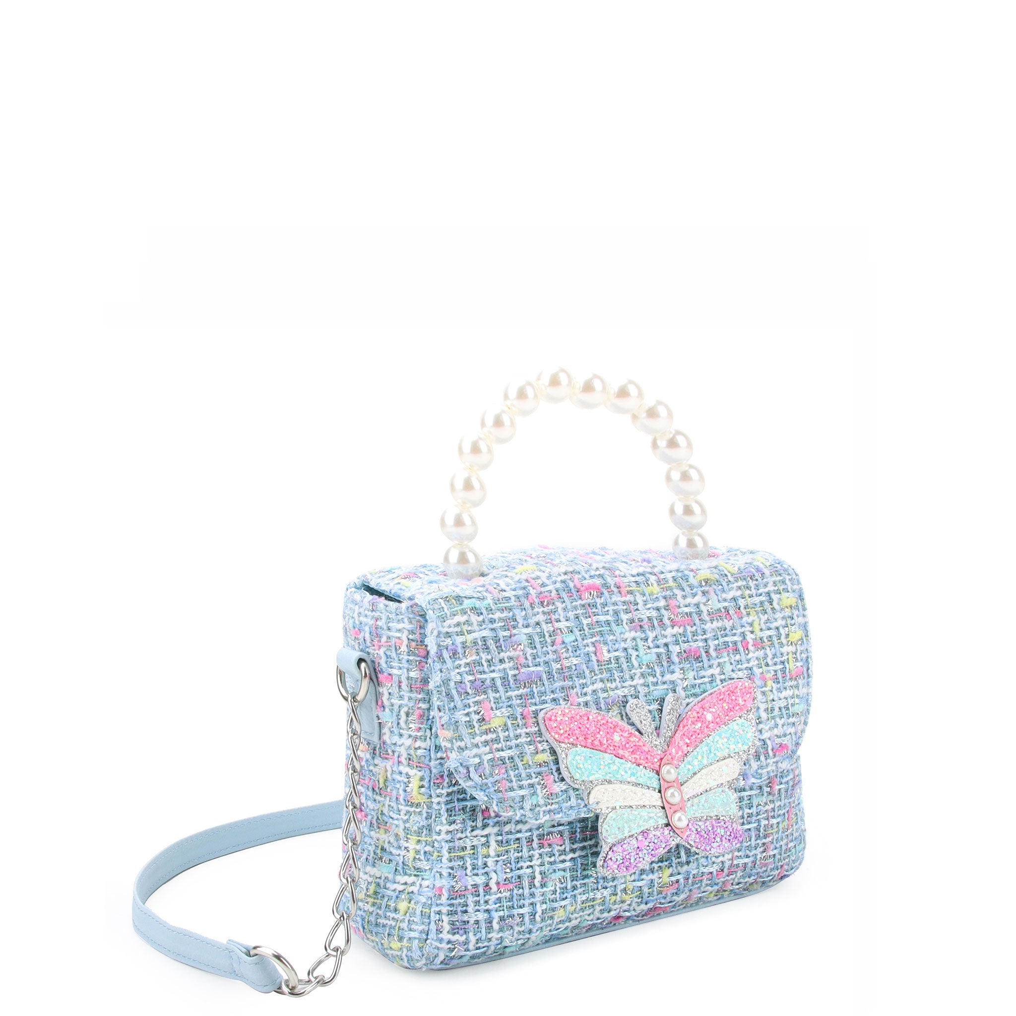 3/4 angle  facing view of a blue tweed mini bag with a pearl handle and glitter butterfly appliqué on the front flap