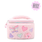 Pink sherpa train case with butterfly, heart, and flower qppliques
