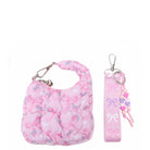 pink quilted bow and floral printed bag charm with detachable wristlet strap