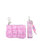 Pink quilted floral and bow printed pouch shaped bag charm with a detachable wristlet strap