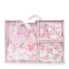 A pink and white plush gift set in a clear plastic case with a handle, featuring a fuzzy hobobag, matching pouch, and keychain accessories decorated with bows and butterfly motifs.