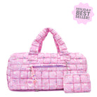 front facing view of a pink large sized quilted scrunch nylon duffle bag with a bow and heart  print and front beaded zipper pocket with a crystal heart charm and matching detachable coin pouch