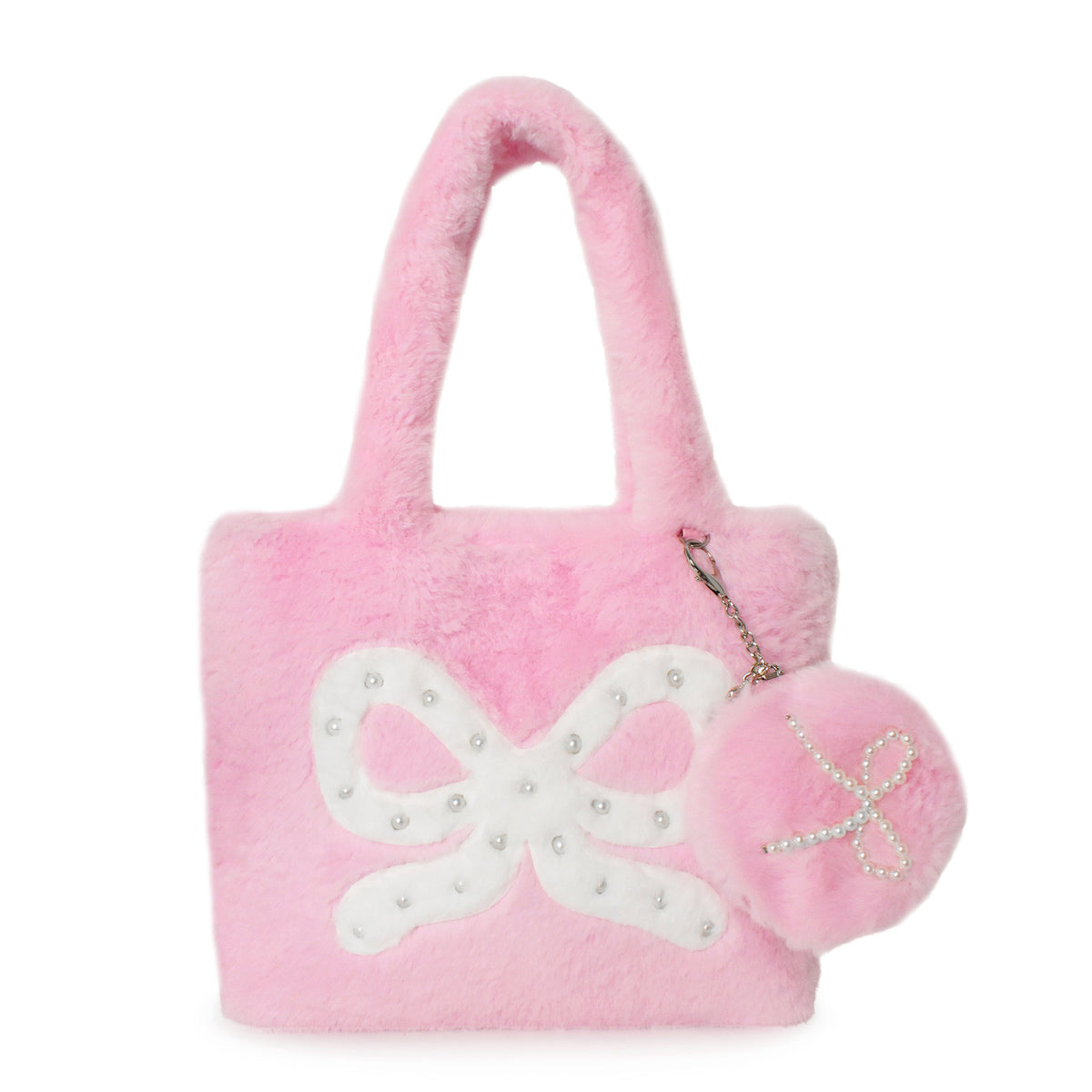 A pink faux fur tote bag with a large white bow applique on the front, decorated with small pearl-like studs, and a matching pink pom-pom keychain with a bow detail hanging from the side.