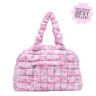 Pink quilted handbag with floral bow pattern on a white background, labeled as a holiday best seller.