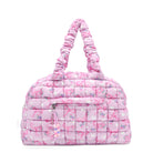front facing view of a pink medium sized quilted scrunch nylon duffle bag with a bow/heart/floral print and front beaded zipper pocket with a crystal heart charm