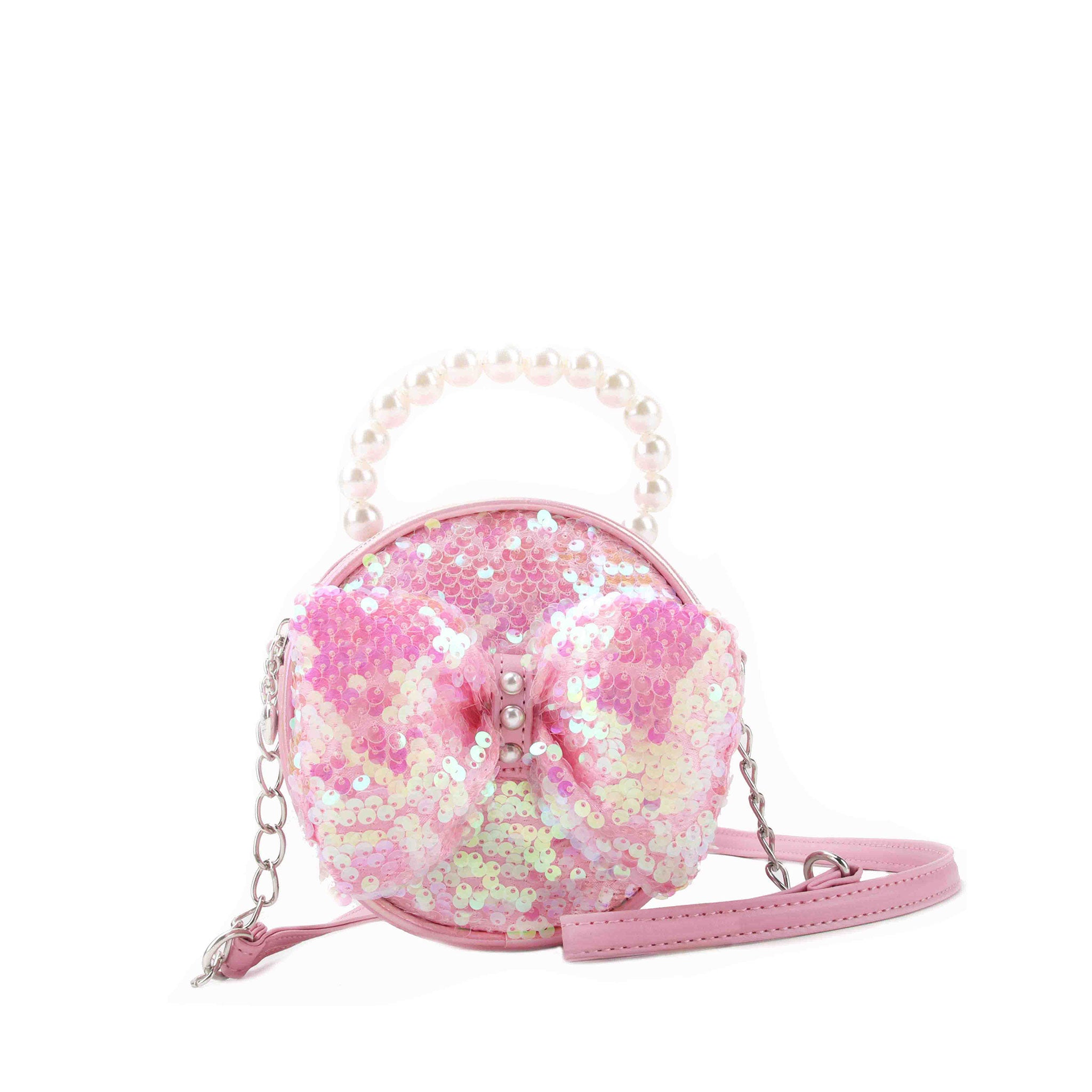 Pink sequin covered circle shaped handbag with a matching puffy bow and pearl topped handle