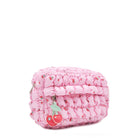 Side view of a cherry printed pink nylon quilted pouch with a cherry keychain charm