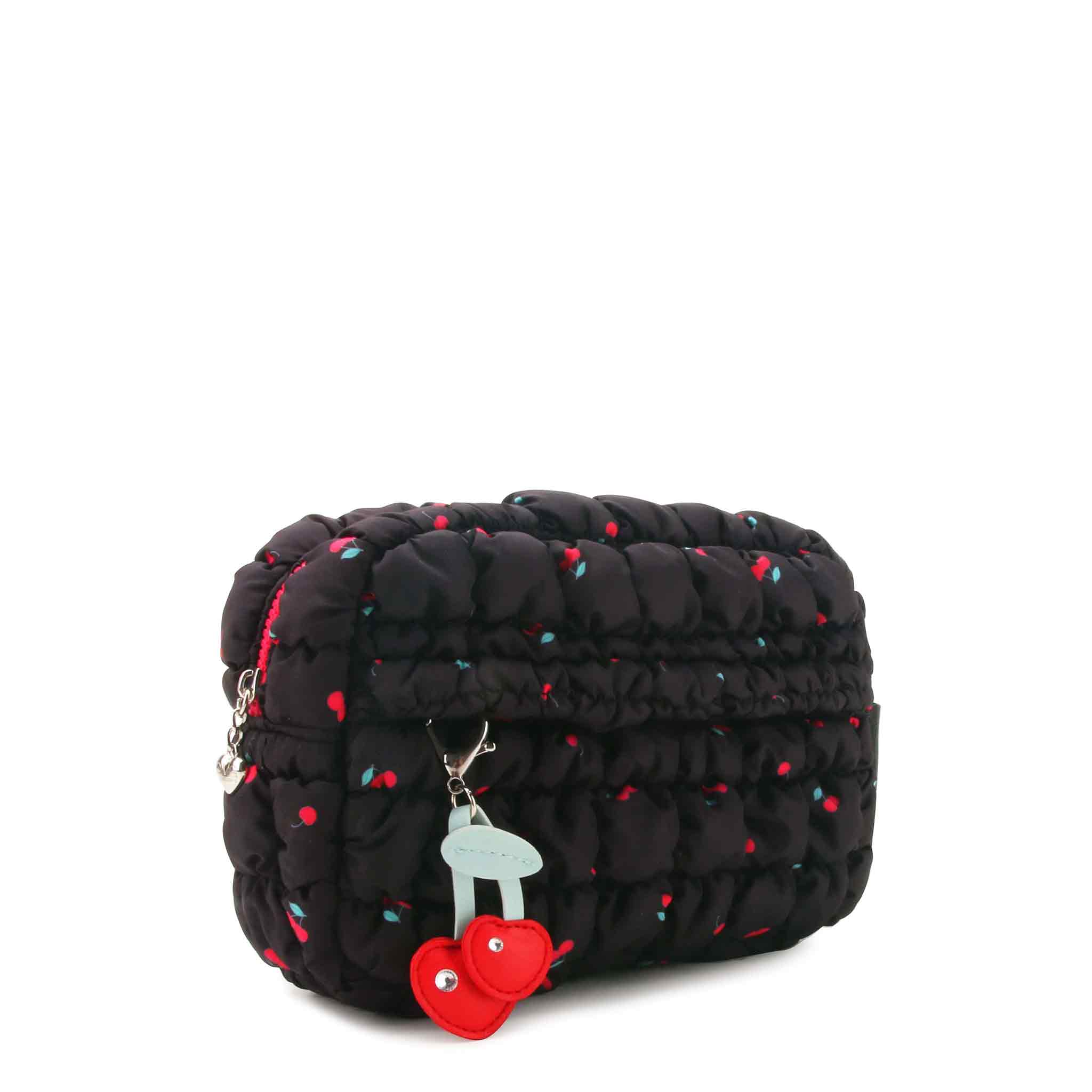 side view of a black , cherry printed nylon quilted pouch with a cherry keychain charm