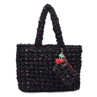 front view of a black cherry printed nylon quilted tote bag with cherry print & a cherry charm keychain 