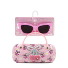 Pink sunglasses with decorative case on a white background