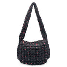 front view of a black colored cherry print quilted nylon hobo style crossbody sling bag