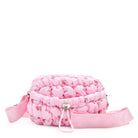 front view of a pink cherry print nylon quilted mini crossbody bag with drawstring closure and a heart strap