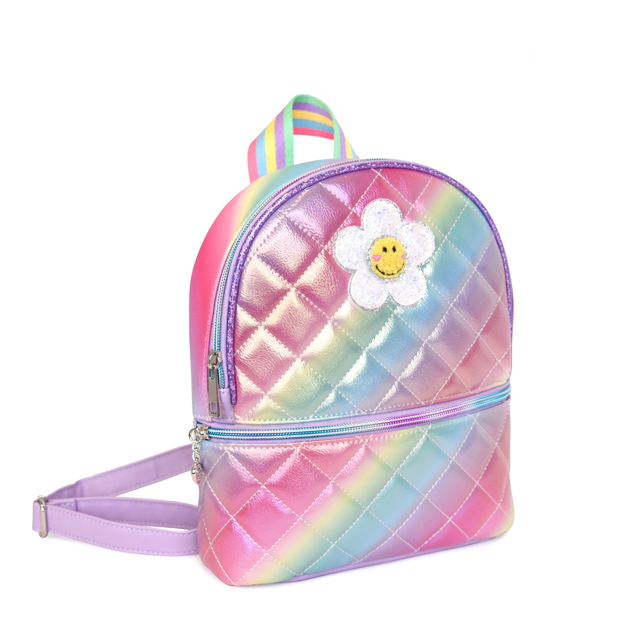 Side view of a rainbow ombre metallic quilted mini backpack with a glitter daisy appliqué
