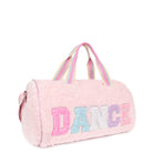 Side view of a pink sherpa large duffle bag with glitter varsity lettering 
